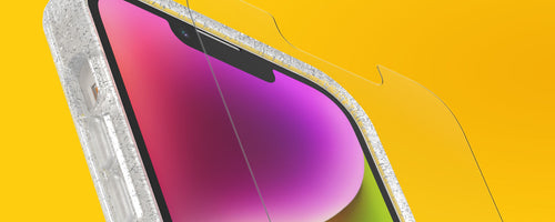 OtterBox glass screen protector being applied to an iPhone on a yellow background