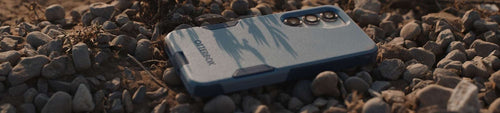 OtterBox Commuter Series phone case for Samsung Galaxy on a gravel background