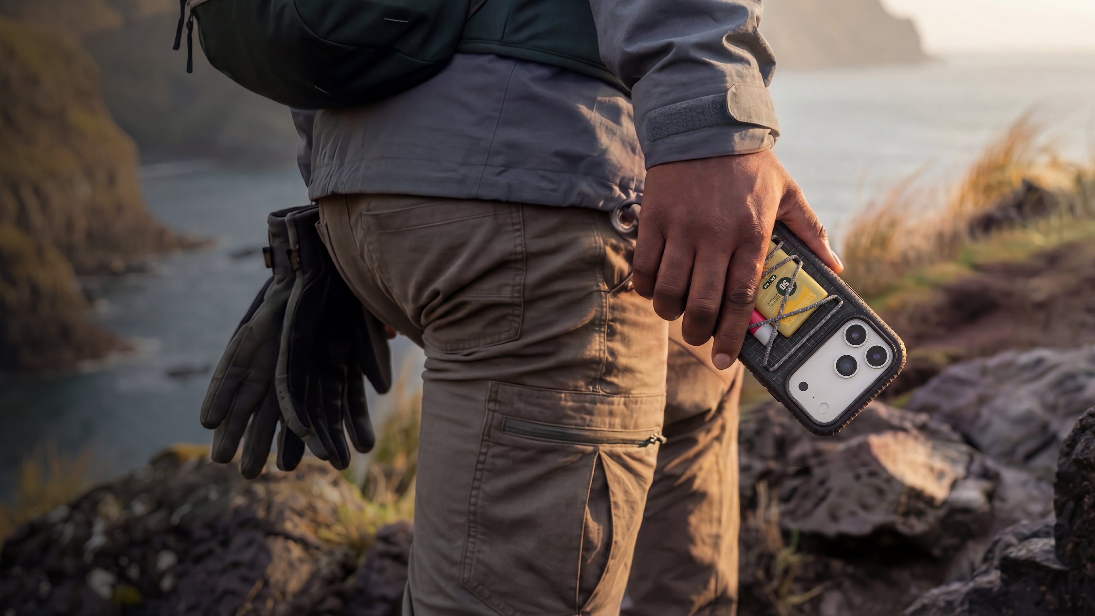 Man holding case in natural background 