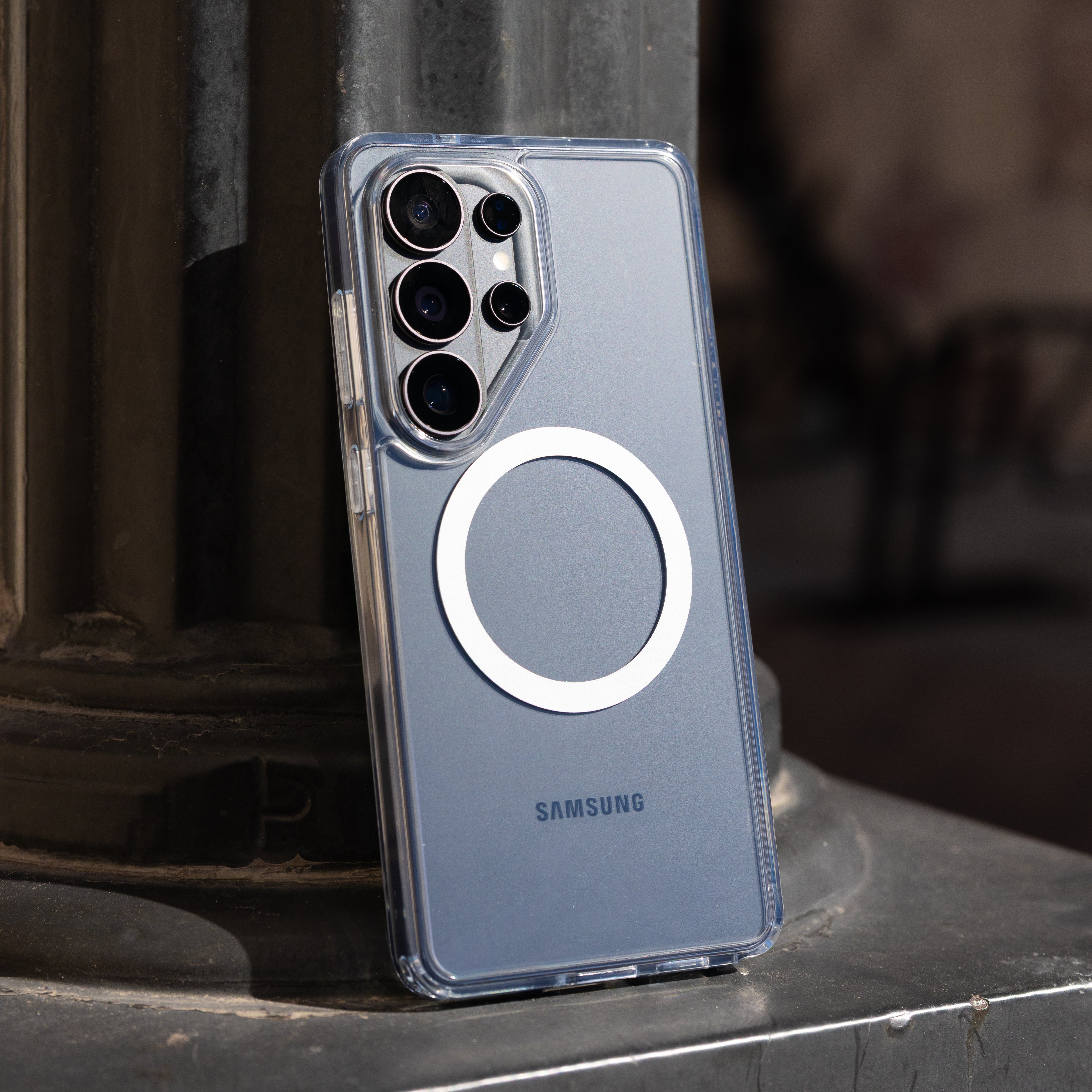 Clear Samsung phone case on a dark surface