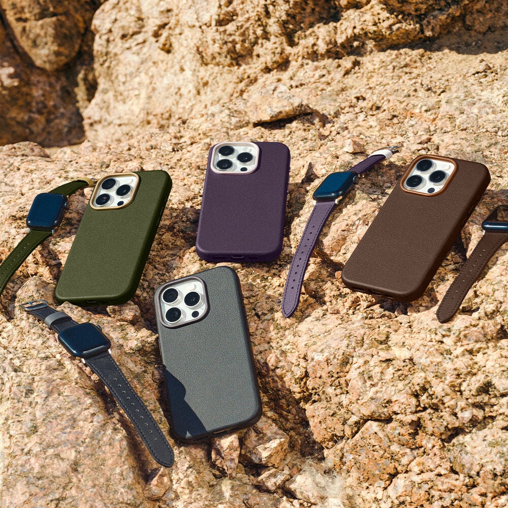 Five cactus leather phone cases and watch bands on a textured stone surface