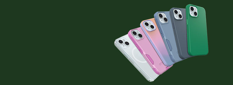 Six smartphone cases in different colors are shown fanned out on a dark green background. The cases include white, pink, peach, blue-gray, gray, and green, with a MagSafe ring visible on the back of each case.