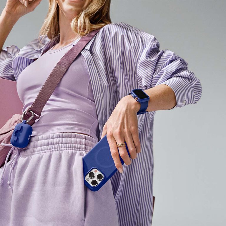 Girl happy with cute pruple iPhone 16 case and matching accessories | OtterBox