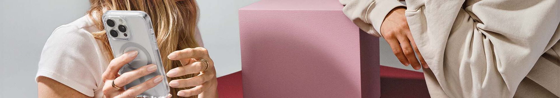 Man and woman happy with their new iPhone 16 cases | Otterbox