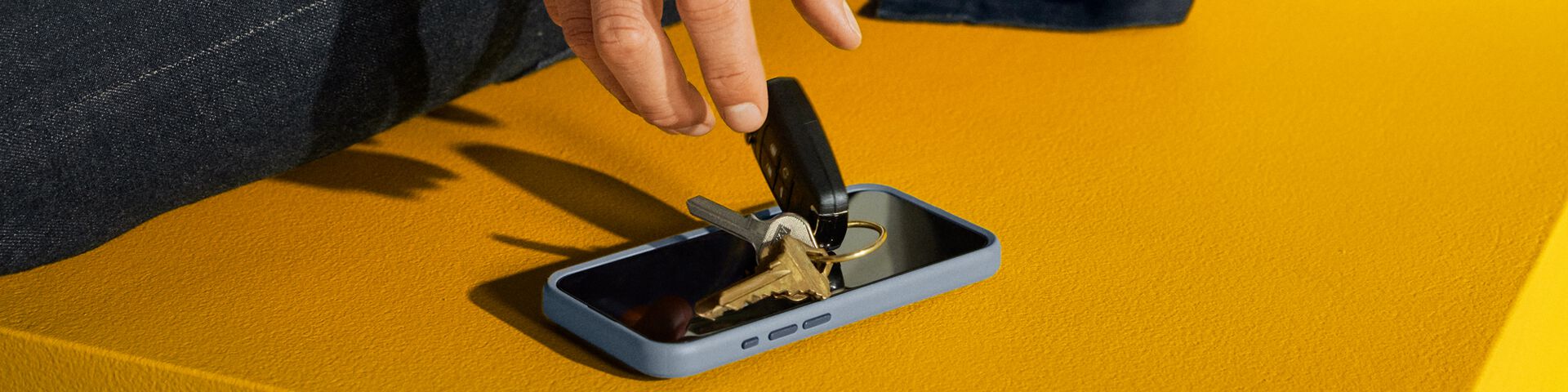 Keys Dropping on Blue Phone Case