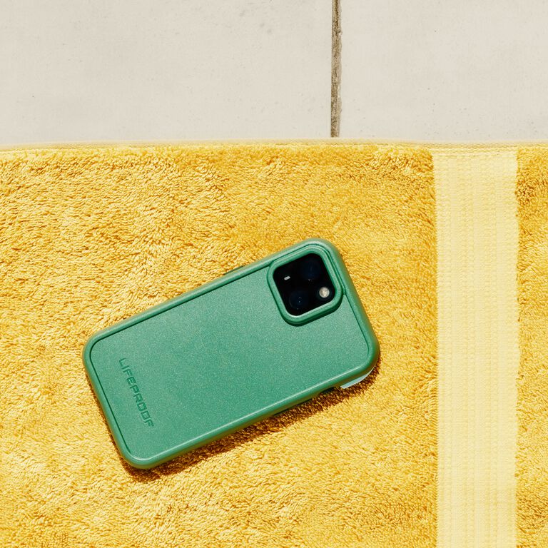 green waterproof iphone case on towel