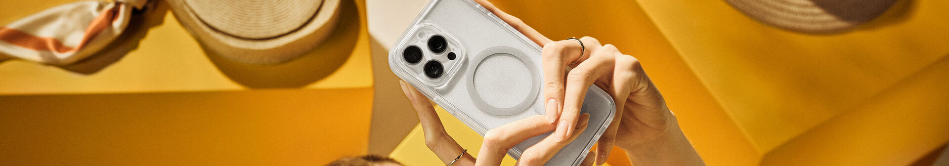 Woman holding clear symmetry series phone case