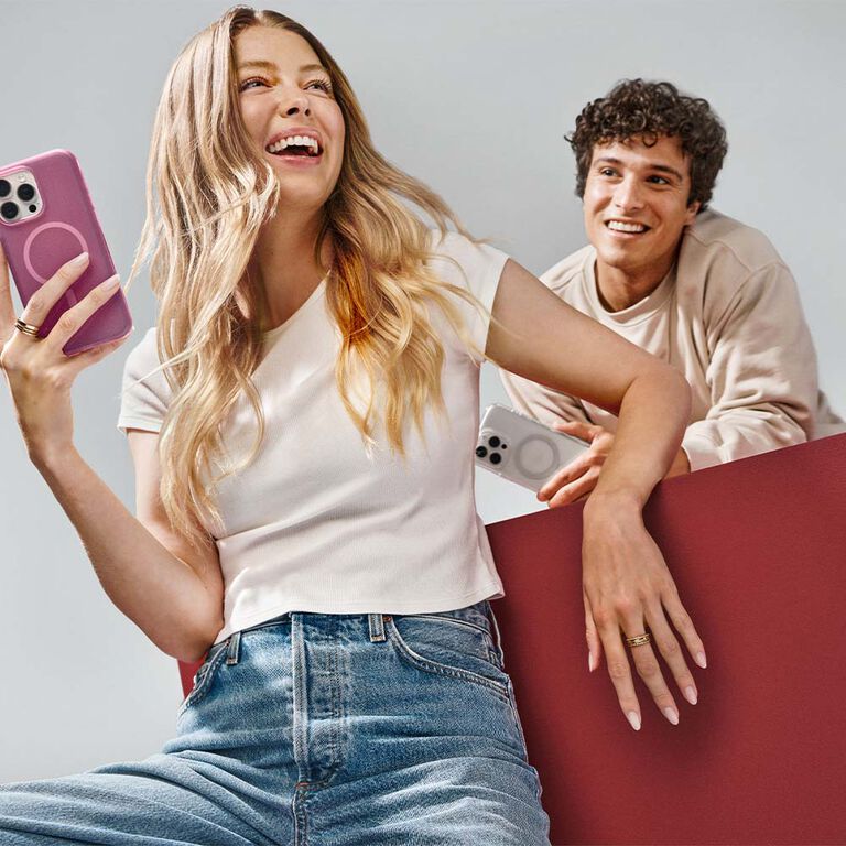 Woman and man holding trendy iPhone 16 cases | OtterBox
