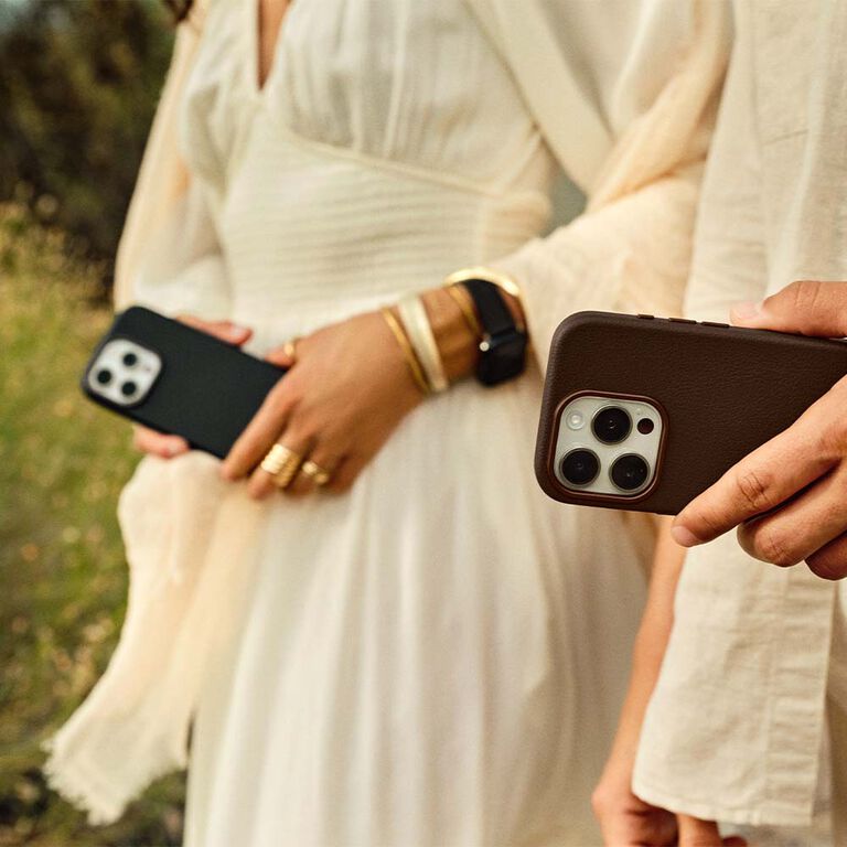 Boho couple holding faux leather phone cases 