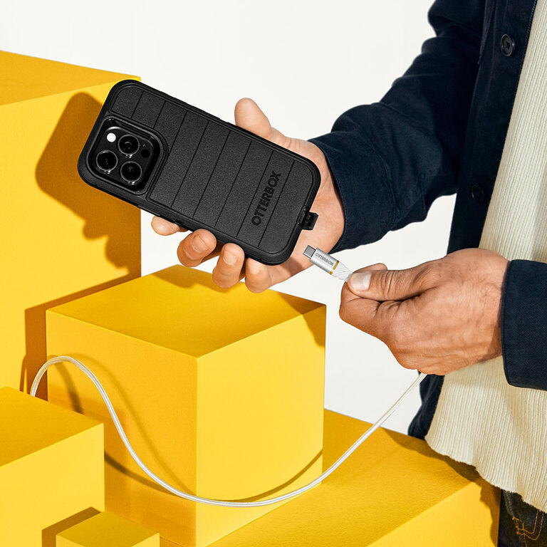 cable plugging into iPhone protected with Defender Series Pro case