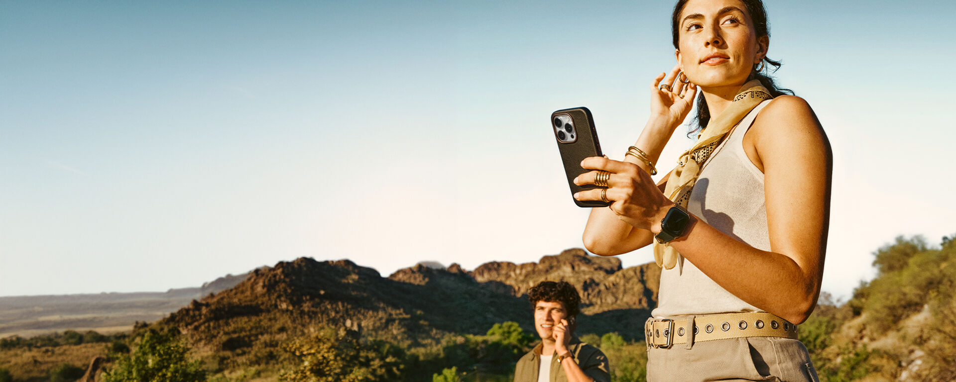 couple hiking mountain holding faux leather iPhone cases