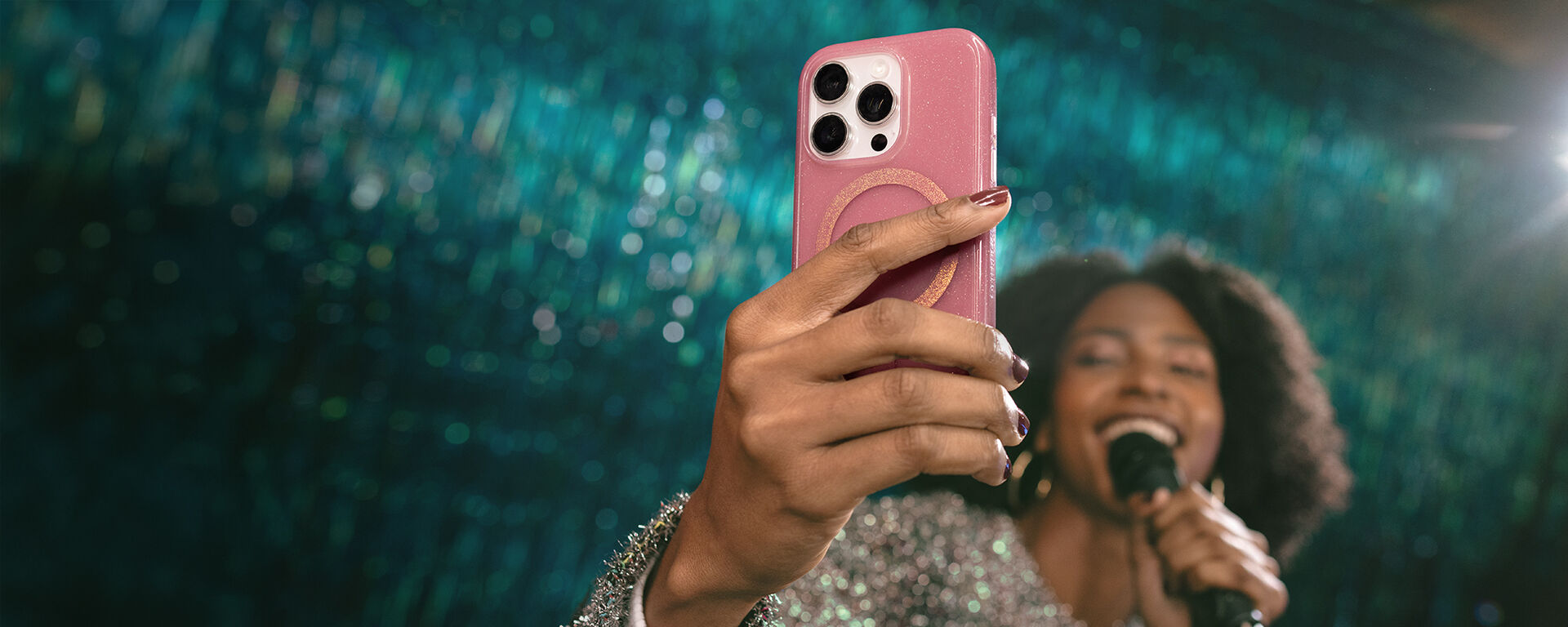 woman holding symmetry pink stardust iPhone 16 Pro case