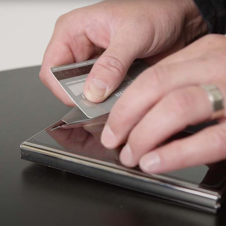 removing a screen protector with credit card